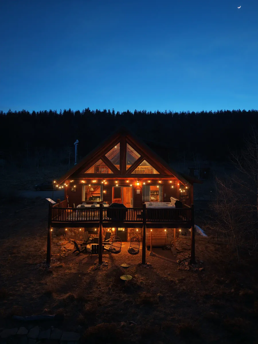 Skyfall Chalet, the founder's short-term rental, surrounded by trees